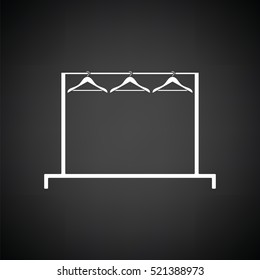 Clothing rail with hangers icon. Black background with white. Vector illustration.