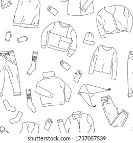 Clothing seamless texture. Pattern. Background for store, shop or package. Black and white pattern with jeans, sweater, socks, mittens