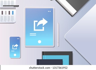 cloud data share online internet sharing network top angle view workplace desktop with tablet pc and smartphone screen synchronization storage office stuff horizontal
