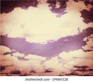 Cloud and sky on grainy paper.
