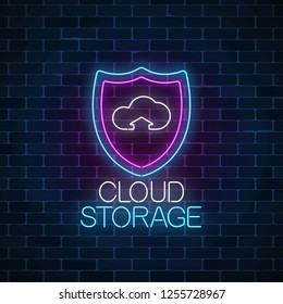 Cloud storage service glowing neon sign on dark brick wall background. Internet technology symbol with shield and cloud. Vector illustration.