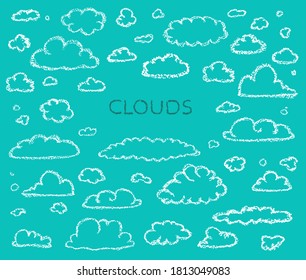 Clouds collection. Children drawing style cloud set. Hand drawn wax crayons art on blue background. Isolated chalk style  clouds icons. Banner, Design elements. White chalk drawn cloud symbol.