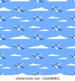 Clouds and gulls vector seamless pattern. Minimalist marine ornament in white and dark blue colors on blue background. Best for textile, print, wrapping paper, package and home decoration.