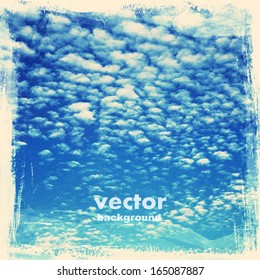 clouds on a textured vintage paper vector background, with grunge stains