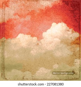 clouds on a textured vintage paper vector background, with grunge stains