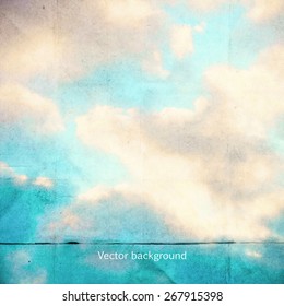 clouds on a textured vintage paper vector background, with grunge stains