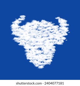 Clouds in the shape of a buffalo head symbol on a blue sky background. A symbol consisting of clouds in the center. Vector illustration on blue background