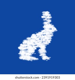 Clouds in the shape of a hare symbol on a blue sky background. A symbol consisting of clouds in the center. Vector illustration on blue background
