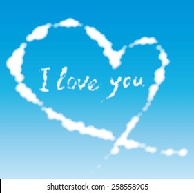 clouds in the shape of heart and declaration of love against the blue sky