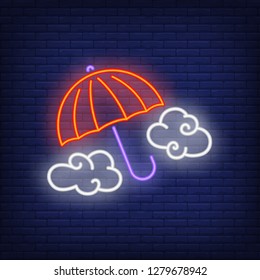 Cloudy weather neon sign. Red umbrella and clouds on brick wall background. Vector illustration in neon style for topics like spring, autumn, raining, forecast