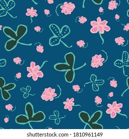 Clover blooms and leaves seamless vector pattern. Meadow themed surface print design for fabrics, stationery, scrapbook paper, packaging, gift wrap, and home decor textiles.