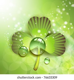 Clover with drops of water over abstract green background