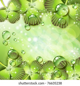 Clover with drops of water over abstract green background