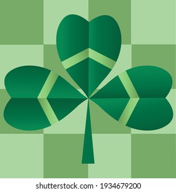 Clover. Irish shamrock leaf on a checkered background.Saint Patrick's Day holiday symbol.