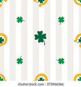 Clover leaf and horseshoe on white background for happy St. Patrick's Day