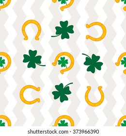 Clover leaf and horseshoe on white background for happy St. Patrick's Day