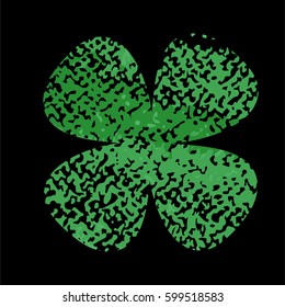 Clover leaf isolated green on black background. Silhouette of four leaf clover with abrasion, spots and scratches. The effect of abrasion and distressed.