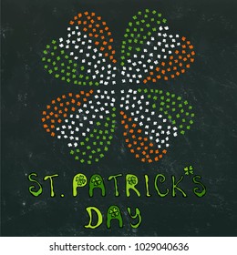 Clover Leaves Heart Shaped Colored in Ireland Flag Colours Green, White, Orange. On a Black Board Background. With St Patricks Day Lettering. Vector Illustration Hand Drawn. Doodle Style.