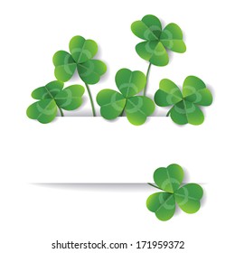 Clover leaves on white background with space for text.