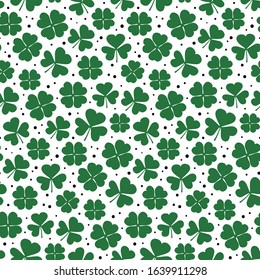 Clover leaves seamless pattern. Green Shamrock repetitive background. Happy St Patricks Day design. Cute simple print. Vector illustration.