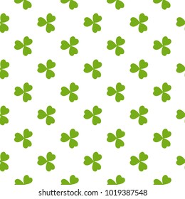 Clover leaves vector seamless pattern. Nature spring background. Irish traditional St. Patrick's day design element in green over white.