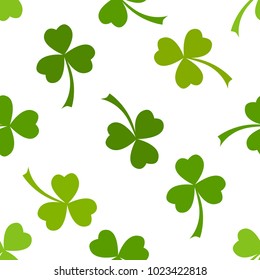Clover leaves vector seamless pattern. Nature spring background. Irish traditional St. Patrick's day design element in green over white.