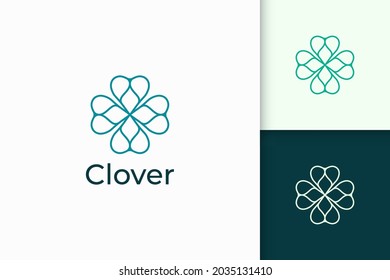 Clover logo in simple line and love shape represent lucky