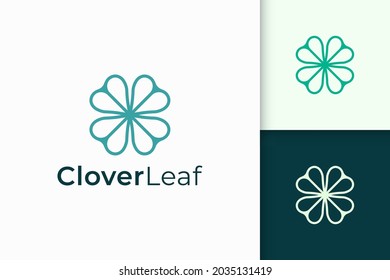 Clover logo in simple line and love shape represent lucky