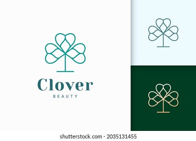 Clover logo in simple line and love shape represent lucky