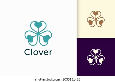 Clover logo with simple love shape represent lucky