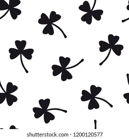 Clover seamless pattern with three leaf. Floral background with hand drawn plants. St. Patricks Day background.  Cute simple minimalist design for paper, textile print, page fill. 