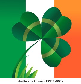Clover. A sheet of shamrock against the backdrop of the Irish flag. An element of St. Patrick's Day celebrations.