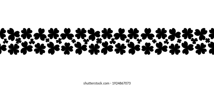 Clover. Silhouette. Seamless horizontal border. Trefoil and four-leafed. Repeating vector pattern. Saint Patrick Day. A leaf that brings good luck. Isolated colorless background. Flat style. 