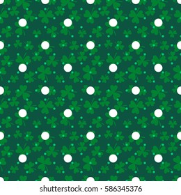 Clover trefoil green leaf seamless dotted vector pattern. St. Patrick's day shamrock plant and white polka dot background.