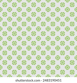 Clover vector repeat pattern. Seamless pattern of green clover leaves. Vector illustration isolated on light gray background. 