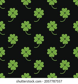 Clover vector seamless pattern on a black background, trendy illustration for printing clothes, paper, fabric.