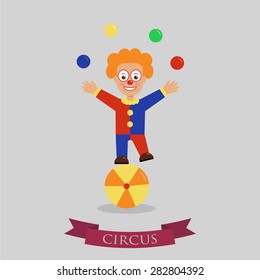 Clown on ball juggling on a light background
