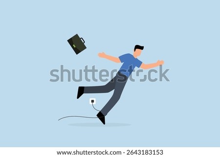 clumsy businessman tripping over power cord electrical plug that fell to the floor.