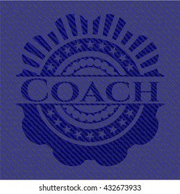 Coach-Abzeichen mit denim Hintergrund