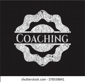 Coaching written on a blackboard