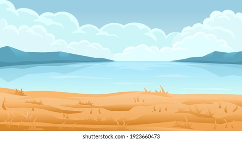 Coast. In the distance mountains and clouds on the horizon.