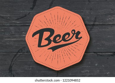Coaster for beer with hand drawn lettering Beer. Monochrome vintage drawing for bar, pub and beer themes. Color coaster for placing a beer mug or a bottle over it with lettering. Vector Illustration