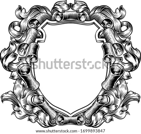 A coat of arms crest scroll and leaves vintage medieval style family heraldic shield decorative background frame.