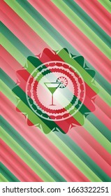 cocktail glass icon inside christmas colors style badge.