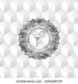 cocktail glass icon inside grey emblem with cube white background