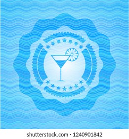 cocktail glass icon inside light blue water emblem.