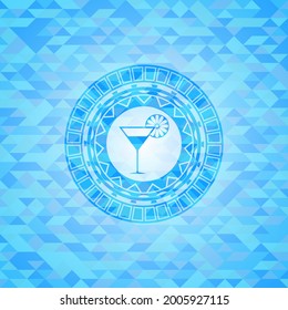 cocktail glass icon inside light blue emblem with triangle mosaic background. 