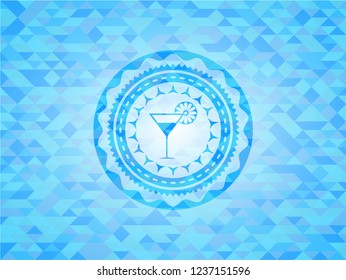 cocktail glass icon inside sky blue emblem with triangle mosaic background