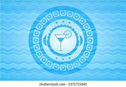 cocktail glass icon inside water wave representation badge.
