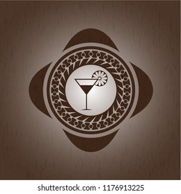 cocktail glass icon inside wooden emblem. Vintage.